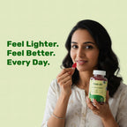 An advertisement featuring a smiling woman holding a bottle of Free on Gut Health Gummies. To her left, bold green text reads, Feel Lighter. Feel Better. Every Day. She is holding a single red, Bear-shaped gummy between her fingers.