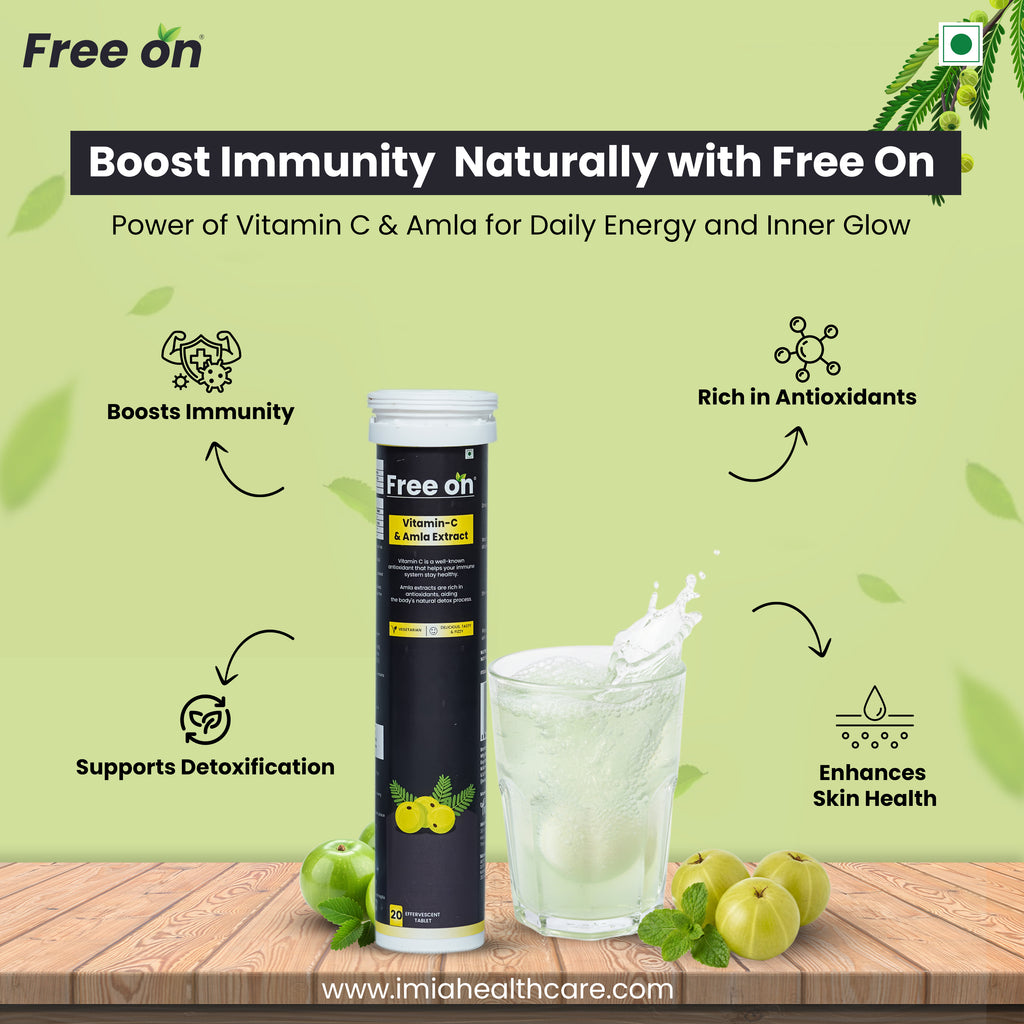 Free On supplement tube with a glass of liquid and apples on a wooden surface, against a green background. Displaying the product features Boost Immunity, Rich in Atioxidants, Supports Detoification & Enhances Skin Health with website www.imiahealthcare.com mention at bttom of the picture 