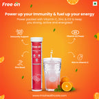 Free on immunity booster supplement with a glass of water and oranges on an orange background. Centered is a tall red and white tube next to a glass of sparkling water with a dissolving effervescent tablet. Icons highlight four key benefits Immunity Support, Zinc Boost, Vitamin D3 Power, and Rich in Vitamin C. with website mentioned below www.imiahealthcare.com