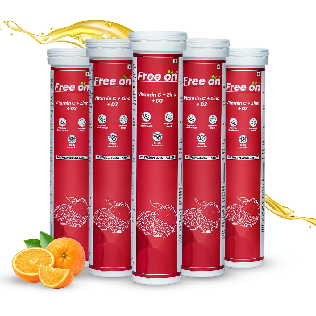 Multiple red and white supplement tubes labeled 'Free on' with oranges and a splash of liquid on a white background.