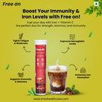 Advertisement for Free on iron supplement with a glass of a dark beverage on a yellow background.