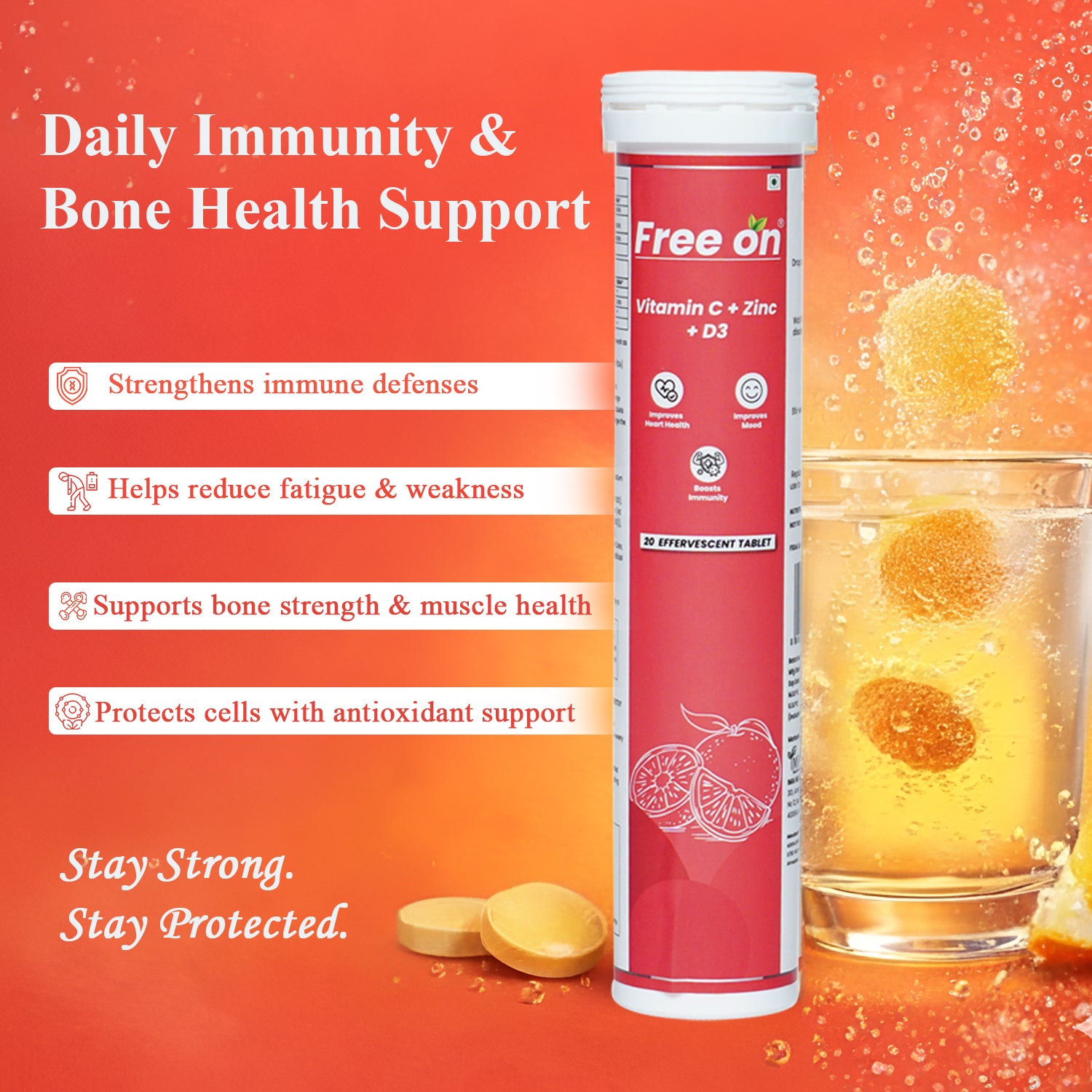 FreeOn Vitamin C + Zinc + D3 supplement tube with a glass of orange juice and lemon slices on an orange background. Describing major points of thi sproduct Strengtheninh immunity, reducing fatigue & weakness, suporting bone strength & muscle health and protect cells with antioxidant 