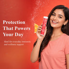 Free On Vitamin C and Zinc effervescent tablet tube against a vibrant red background with a splashing orange slice. with highlighted text Protection That Powers Your Day for daily immunity and wellness support.